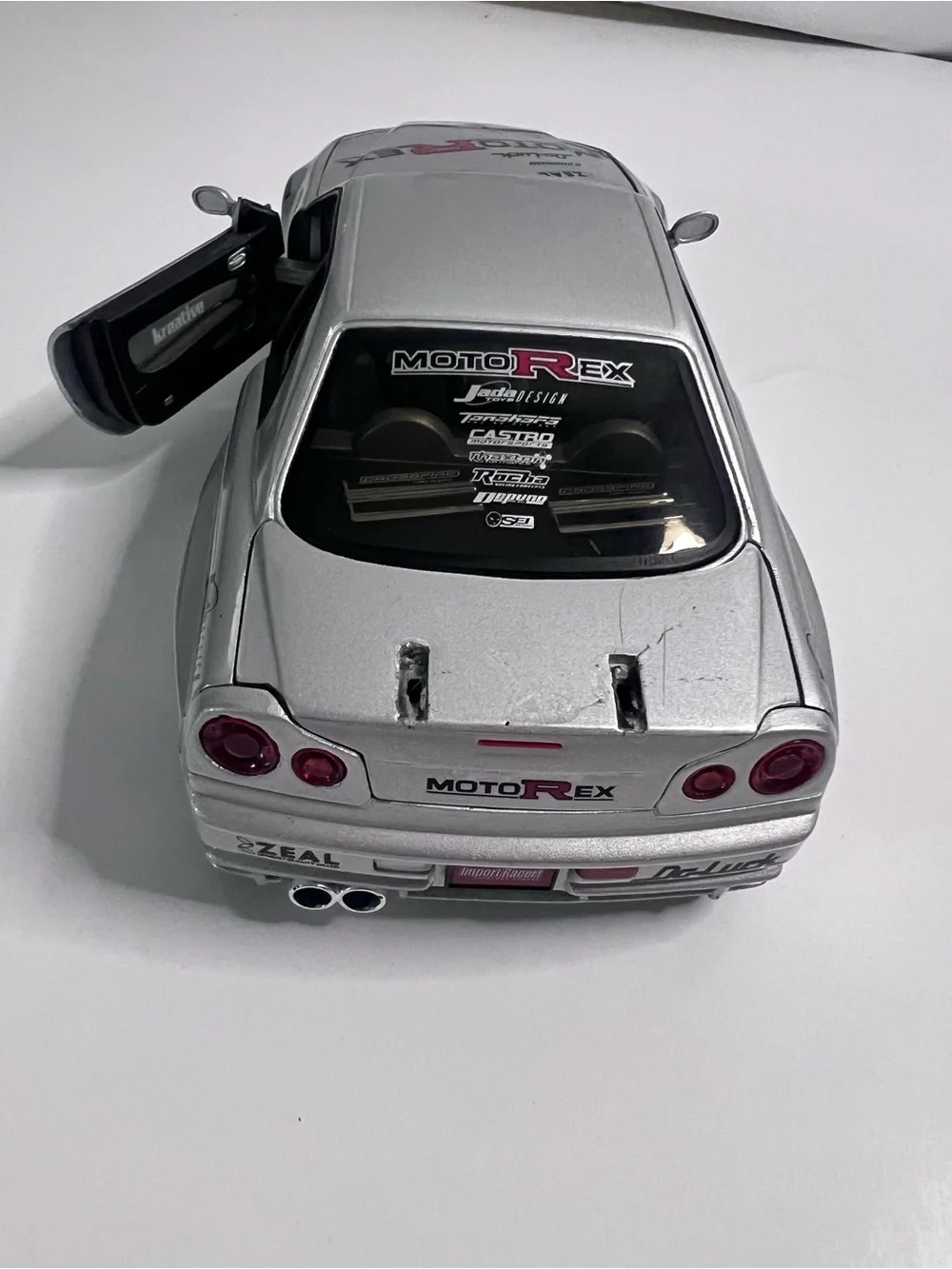 Nissan Skyline GT-R R34 Import Racer MotoRex Diecast 1:18 Escala - Coleccionable